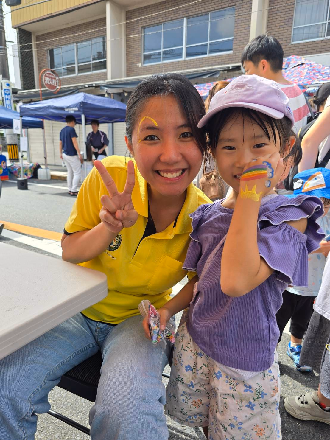 Two students posing together at Tamariba Fest